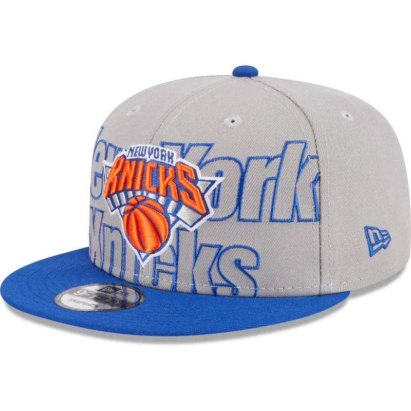 graue-und-blaue-flatcap-snapback-9fifty-draft-edition-2023-der-new-york-knicks-nba-von-new-era