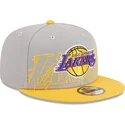 graue-und-gelbe-snapback-kappe-9fifty-draft-edition-2023-der-los-angeles-lakers-nba-von-new-era