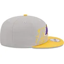 graue-und-gelbe-snapback-kappe-9fifty-draft-edition-2023-der-los-angeles-lakers-nba-von-new-era