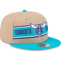 braune-und-blaue-flatcap-snapback-9fifty-draft-2024-der-charlotte-hornets-nba-von-new-era