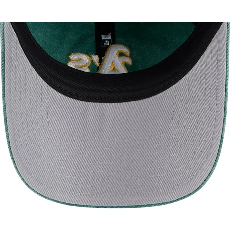 grune-verstellbare-curved-cap-9twenty-washed-contrast-der-oakland-athletics-mlb-von-new-era