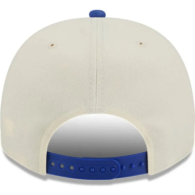beige-och-bla-snapback-keps-med-bojd-skarm-9fifty-a-frame-precurved-hardwood-classics-new-york-knicks-nba-fran-new-era
